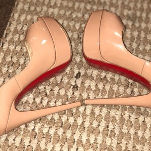 Christian Louis Vuitton, red bottoms.